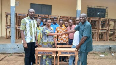 Photo of Old students of Anlo Senior High School support Alma matter with mono desks 